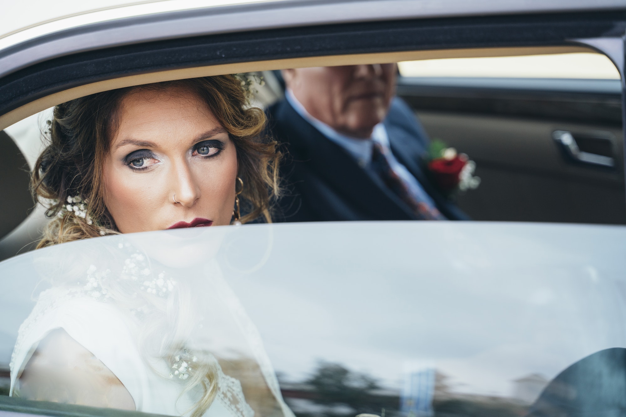 the bride arriving to the wedding by car.